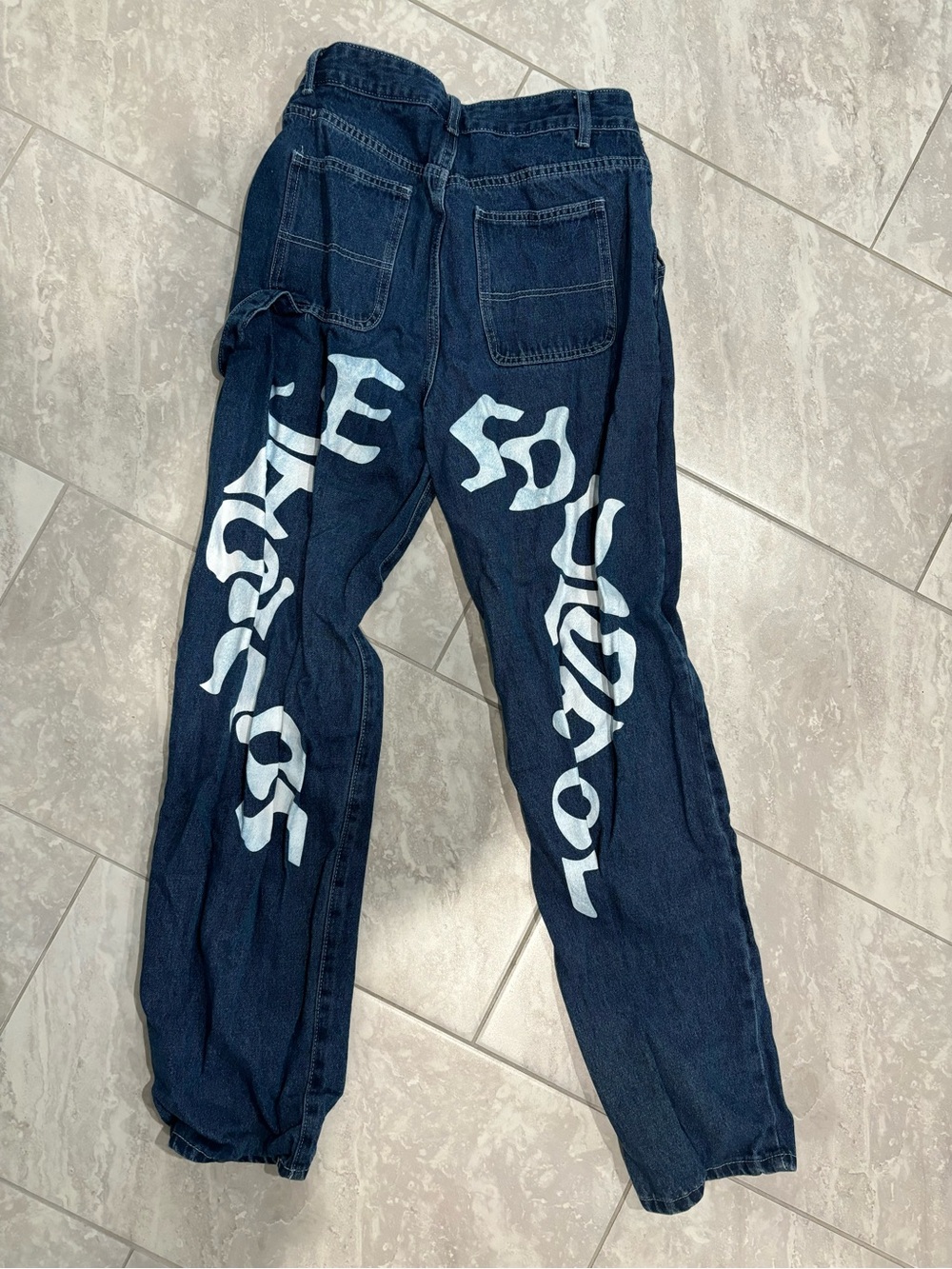 Jeans with white lettering